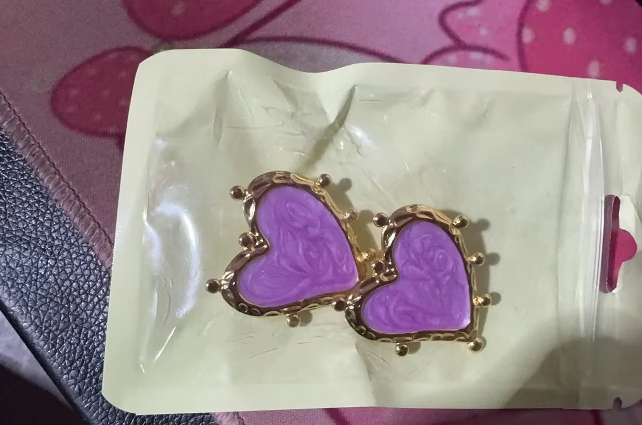 Elegant stainless steel heart-shaped earrings in a range of captivating colours, perfect for adding a touch of romantic flair to any outfit.