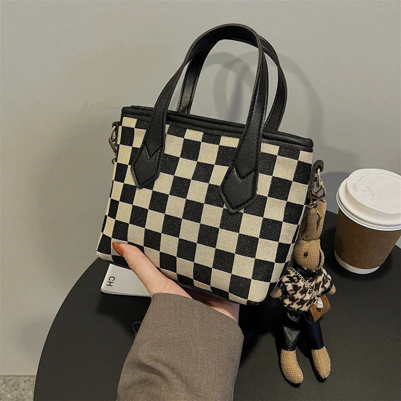 Stylish houndstooth shoulder bags in various colors, including black, coffee, and brown, with and without pendants, featuring a portable and versatile design for everyday use.