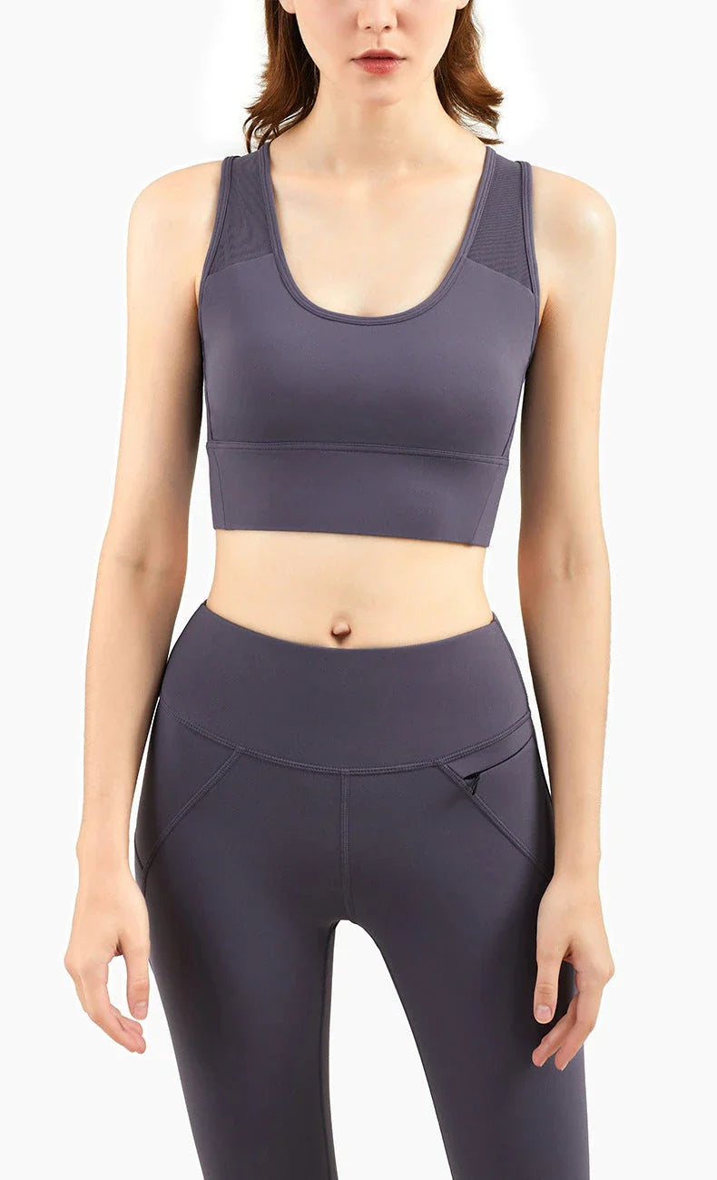 Supportive sports bra with full-coverage V-back design, padded cups, and shock-absorbing technology for active women