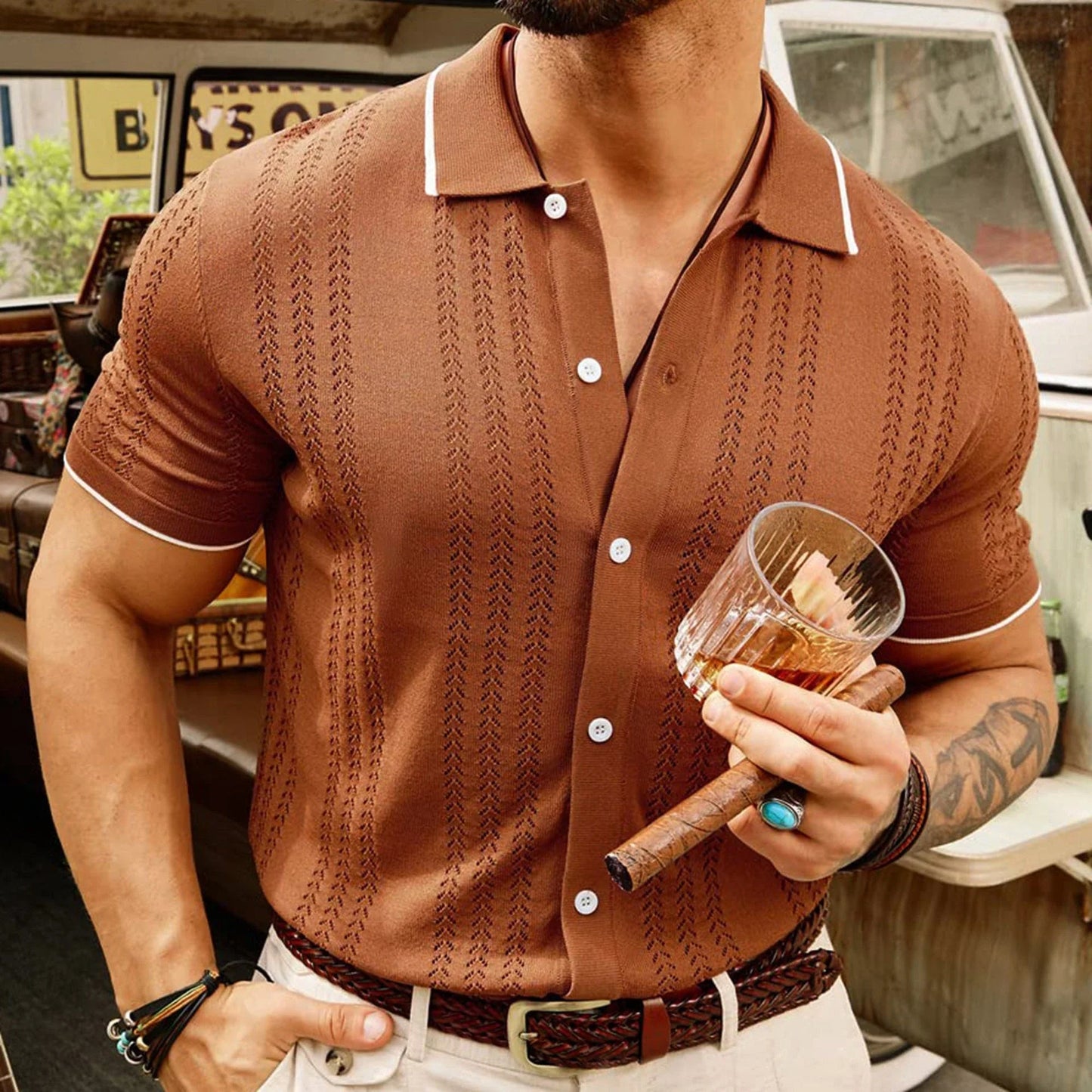 Stylish short-sleeved polo shirt with unique flocked design, available in a variety of rich colors for versatile summer style