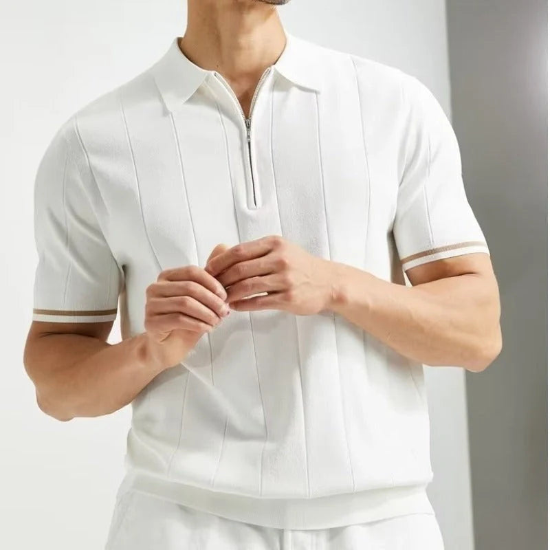 Short-sleeved polo shirt with zipper collar, available in white and dark blue colours, suitable for British summer style.