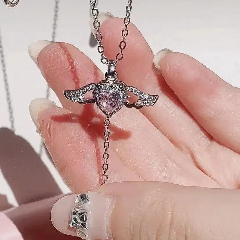 Enchanting necklace with Cupid heart and fluttering angel wings, crafted with titanium steel and sparkling zircon crystals