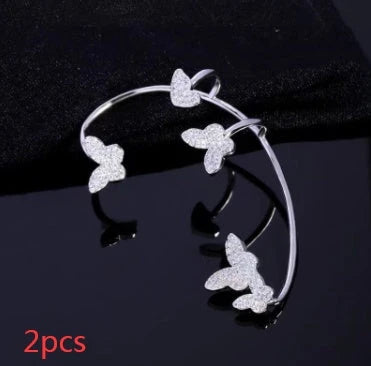 Sparkling butterfly-shaped ear cuffs with zirconia stones, available in gold and silver alloy finishes