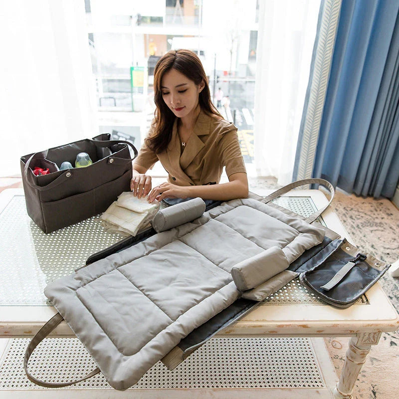 A premium quality mother and baby bag made from soft, durable Oxford cloth with a large 20-35L capacity, versatile backpack or shoulder bag design, and customisable interior pockets.