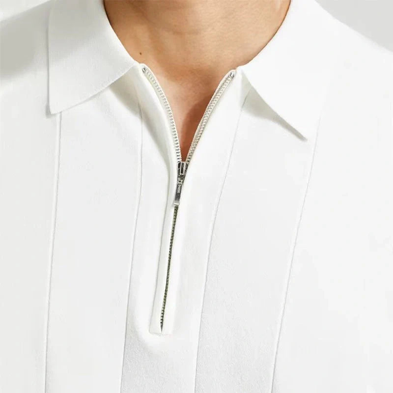 Short-sleeved polo shirt with zipper collar, available in white and dark blue colours, suitable for British summer style.