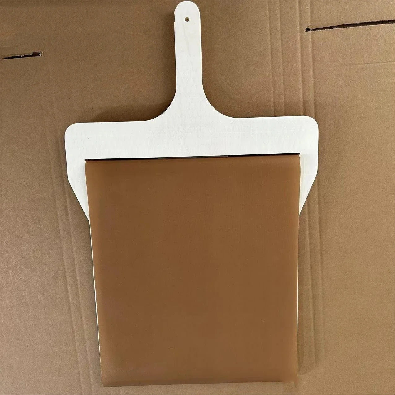Wooden pizza peel with various size options, perfect for transferring baked goods from oven to table