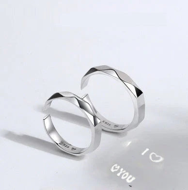 Stylish sterling silver rings with a hidden love pattern design, perfect for romantic gifts or personal accessorizing.