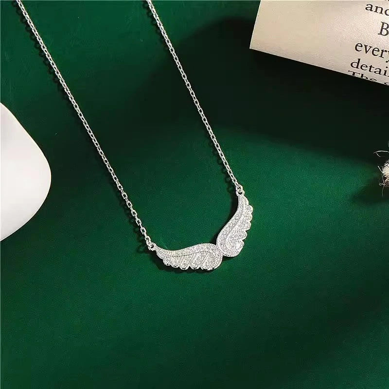 Stunning sterling silver angel wings pendant necklace with cubic zirconia stones