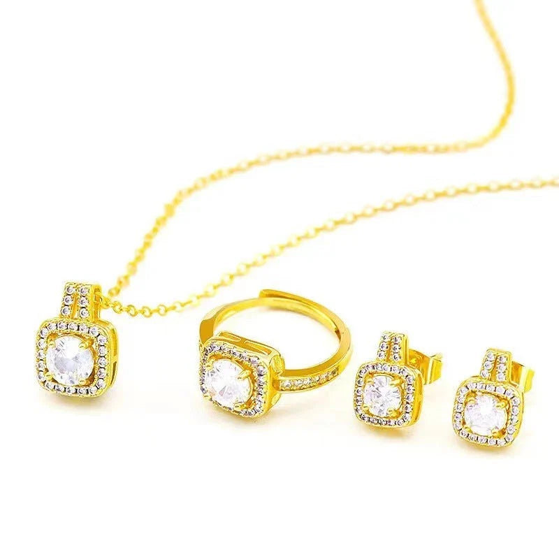 Elegant gold-toned jewelry set with zircon gemstone pendant necklace, stud earrings, and statement ring