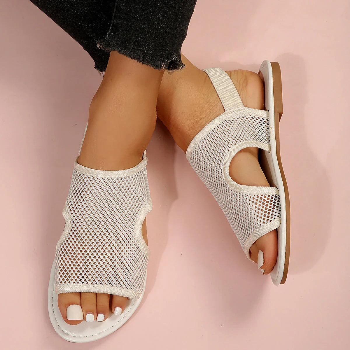 Breathable mesh sandals in various colors, featuring a lightweight design for summer comfort and style