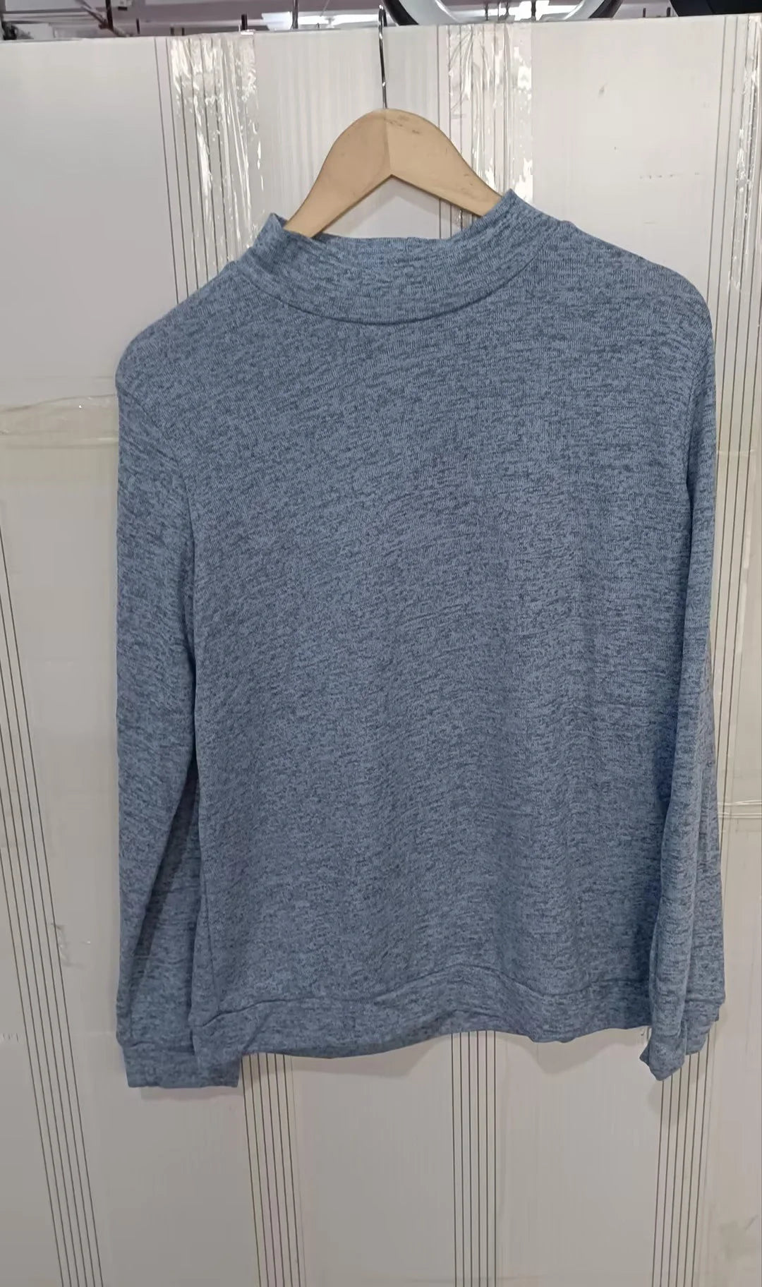 A long sleeve knitted jumper in various solid colours, including light gray, black, khaki, blue, and pink
