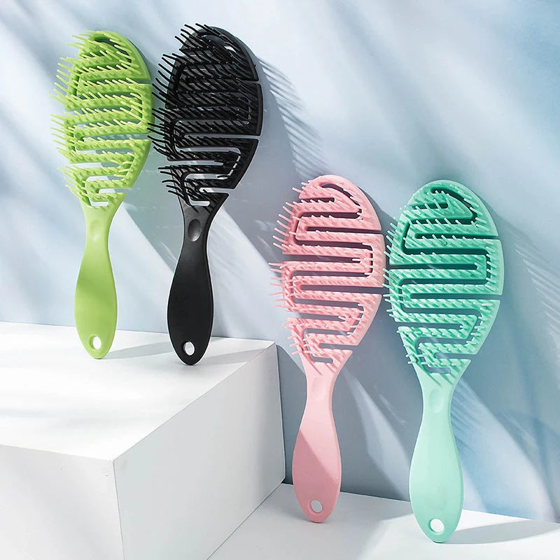 Stylish Massage Comb in various colours offering a soothing scalp massage and modern, minimalist design