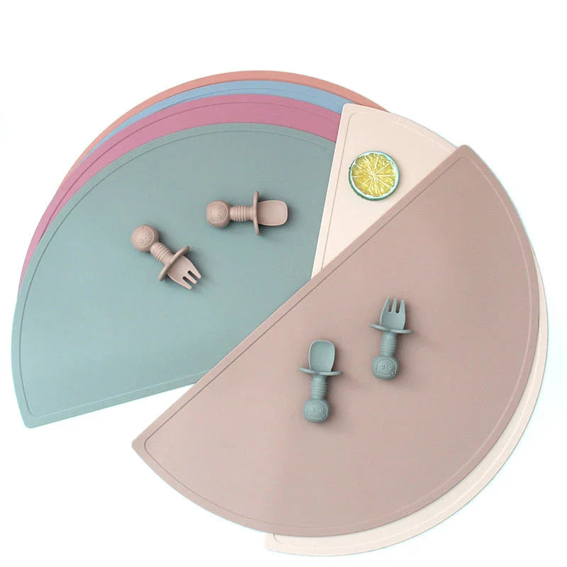 Durable silicone placemat in various colors, featuring waterproof and stain-resistant properties for easy cleaning
