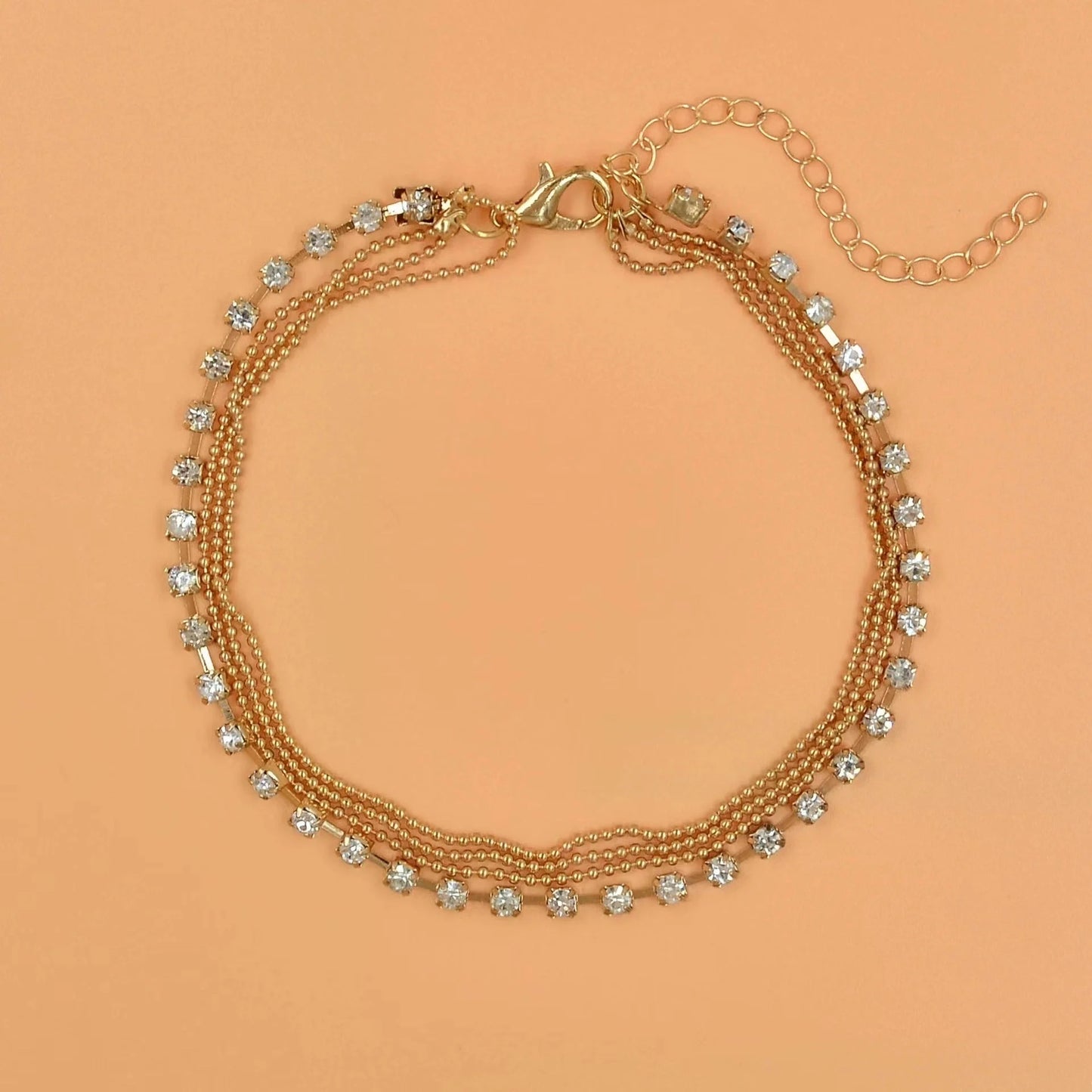 Stylish multi-layer beaded anklet necklace set with a geometric design in gold and silver tones