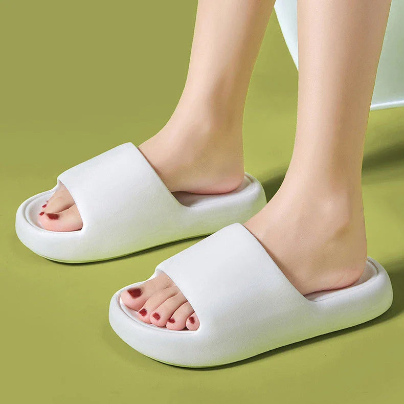 Comfortable EVA foam slip-on slippers in various colors, featuring non-slip soles and a breathable design for indoor and bathroom use.