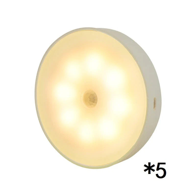 Motion-activated LED puck lights in warm and white color options, with various pack sizes and USB recharging