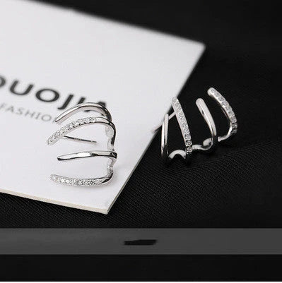 Radiant sterling silver earrings with four-prong zircon stone settings, elegant and fashionable jewelry for women