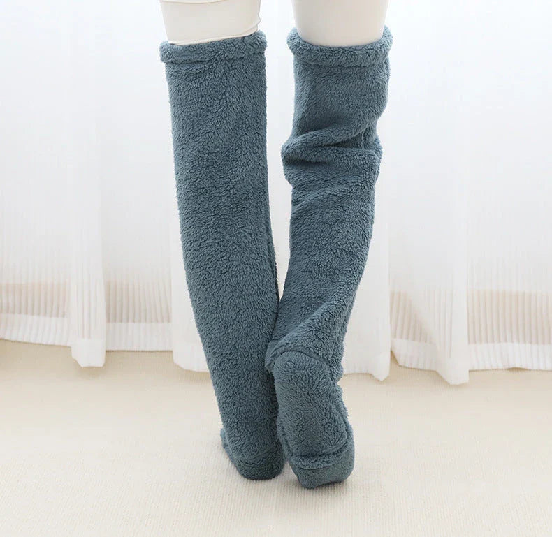 Cozy over-the-knee fuzzy socks in various colors, including brown, blue, dark gray, and pink purple