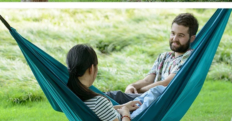 Premium double hammock for outdoor camping and hunting, made with soft, breathable fabric and reinforced climbing ropes