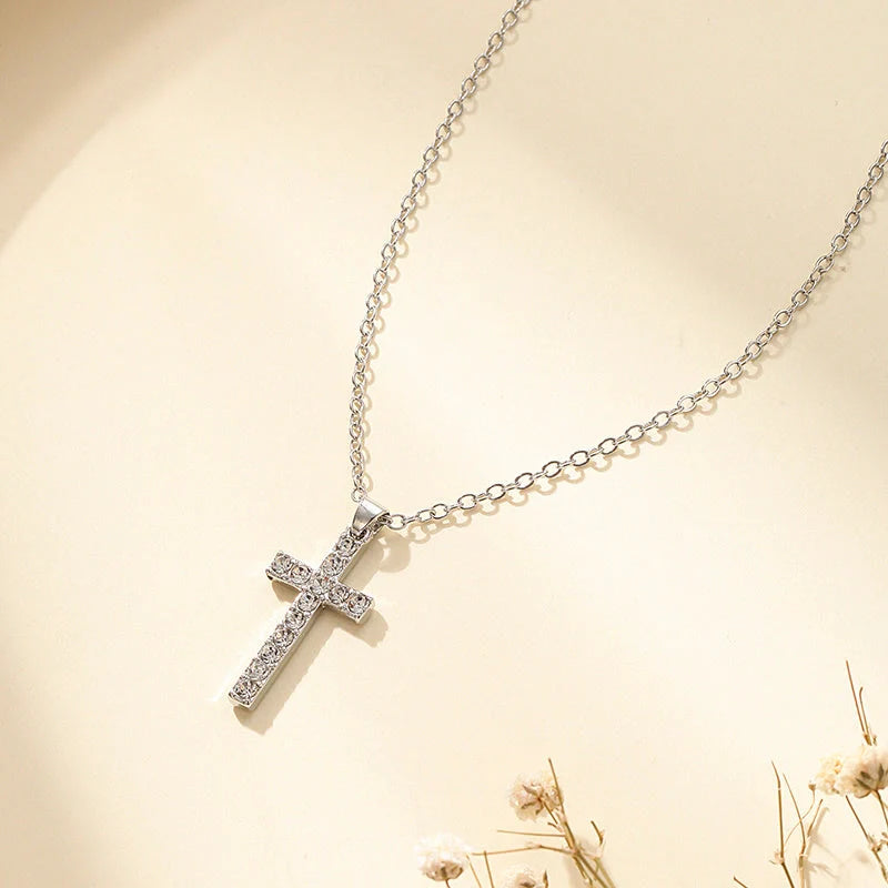 Elegant silver-toned Jesus cross pendant necklace with sparkling artificial gems, showcasing premium British craftsmanship