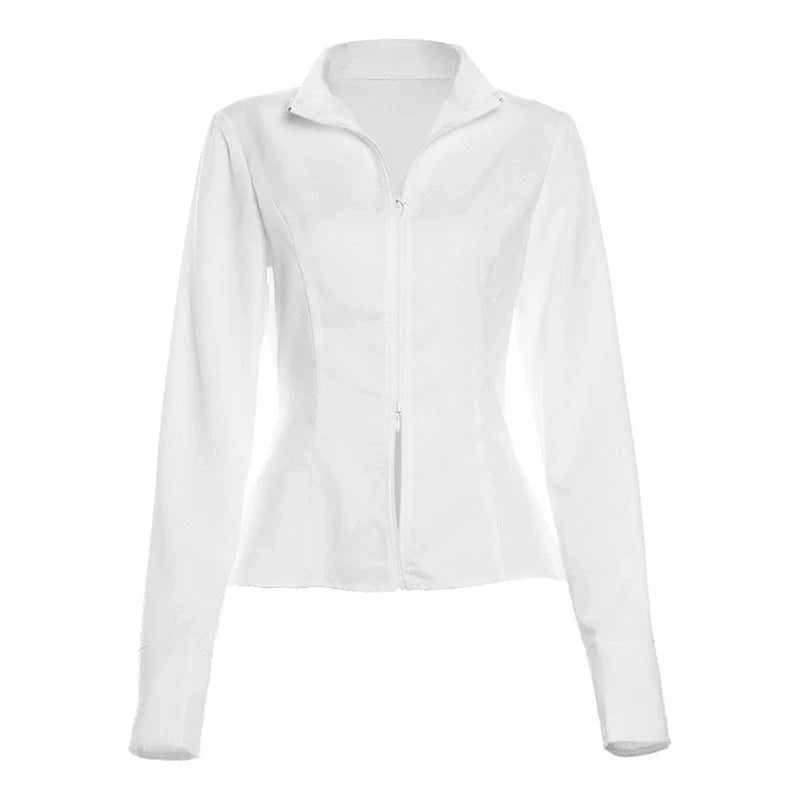 Fashionable two-piece set featuring a tailored top with V-neck and long sleeves, and a chic mini skirt. Available in white and black colours.