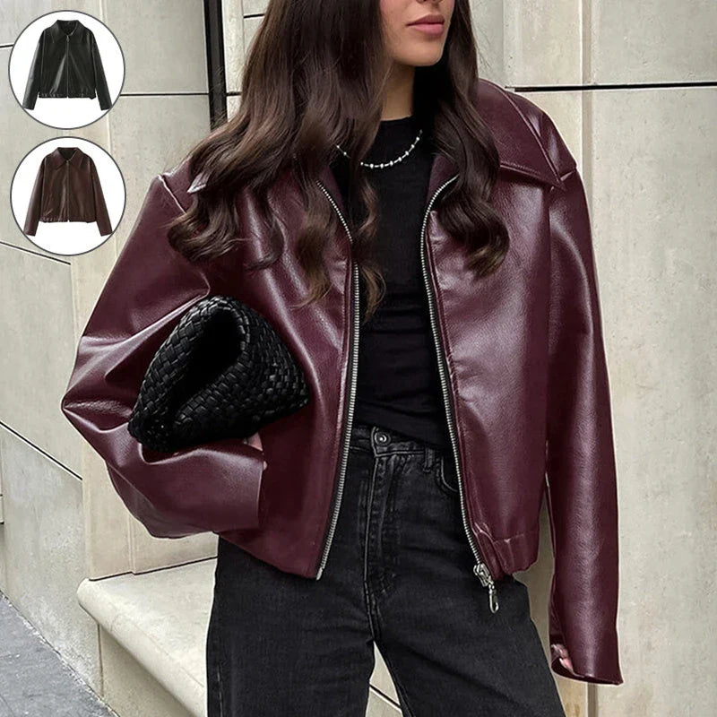Fashionable faux leather jacket in burgundy and black colors, featuring a zipper closure and long sleeves for casual, versatile wear