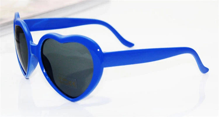 Stylish heart-shaped sunglasses with unique lens design that transforms light into enchanting special effects