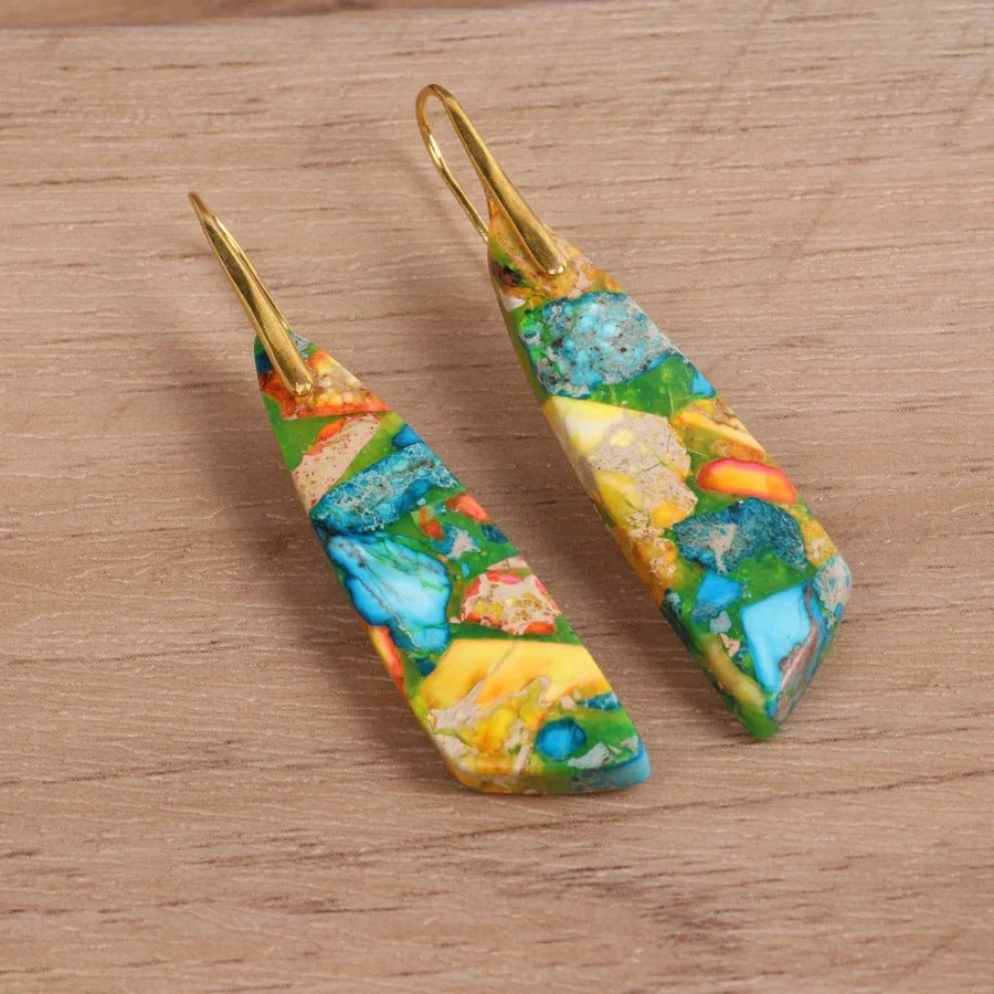 Geometric flower shape pendant earrings in copper with gold hooks, available in red, green, and blue.