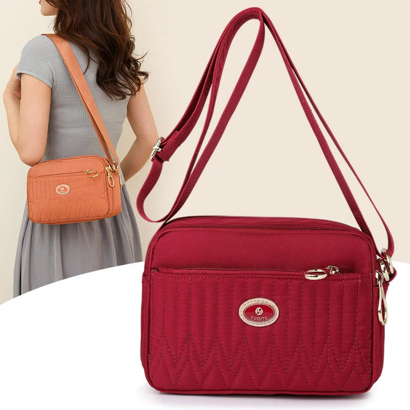 Women's lightweight nylon cross body messenger bag in various colours