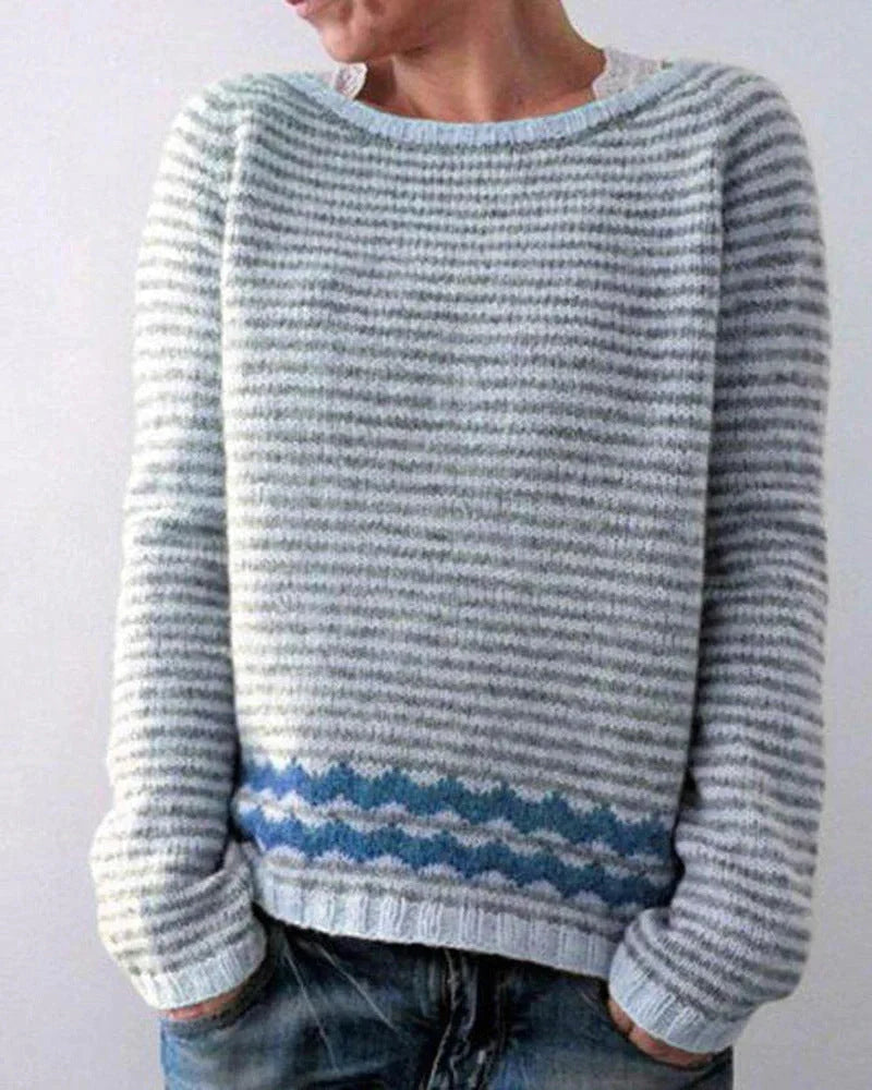 A stylish loose-fit knit jumper with a variety of colourful patterns and designs