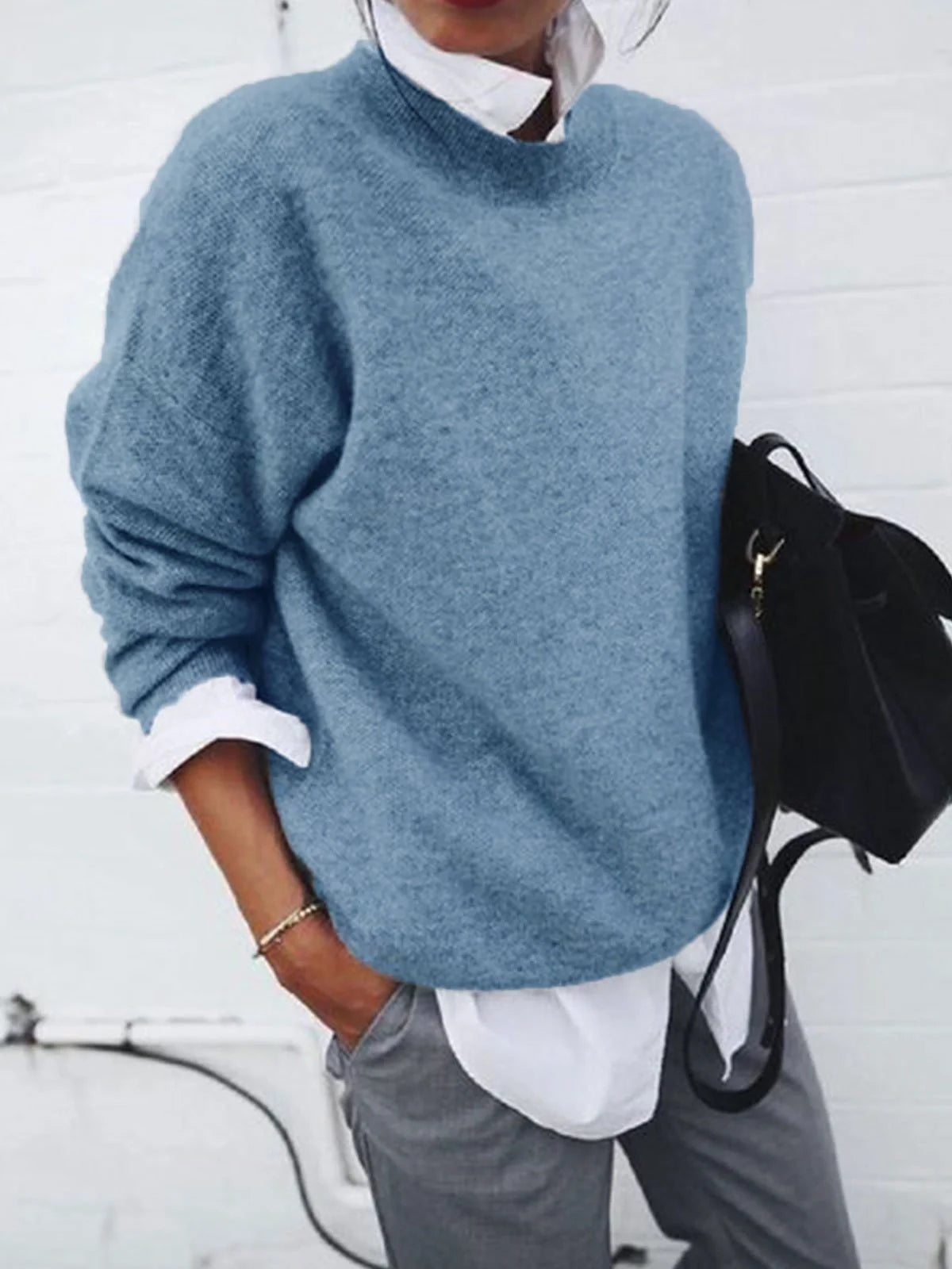 A long sleeve knitted jumper in various solid colours, including light gray, black, khaki, blue, and pink