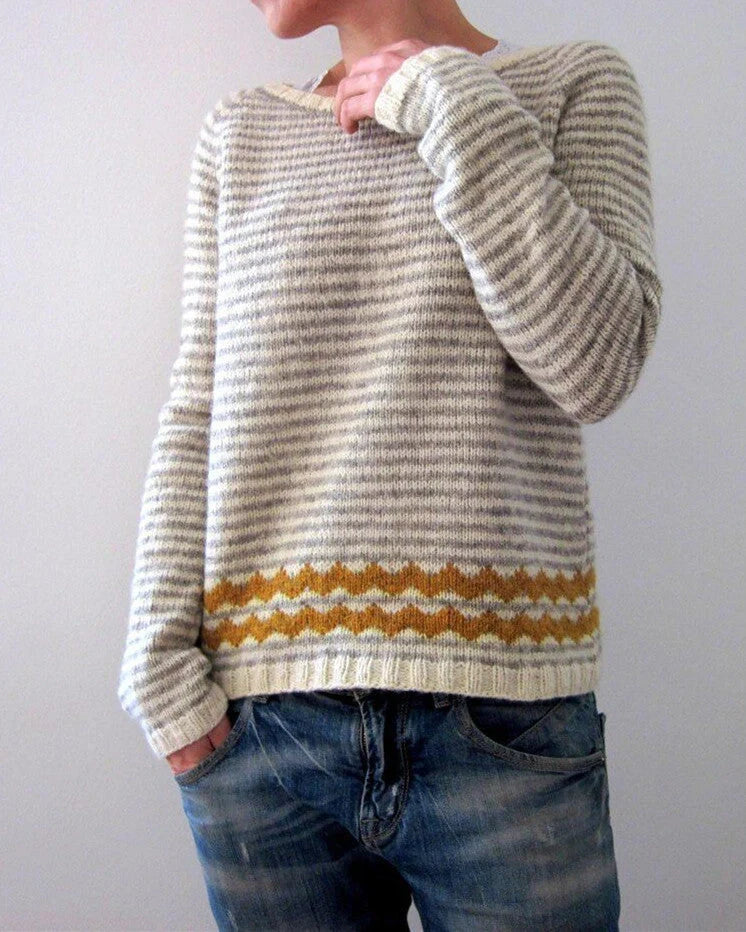 A stylish loose-fit knit jumper with a variety of colourful patterns and designs