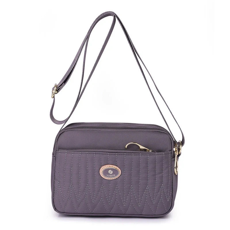 Women's lightweight nylon cross body messenger bag in various colours