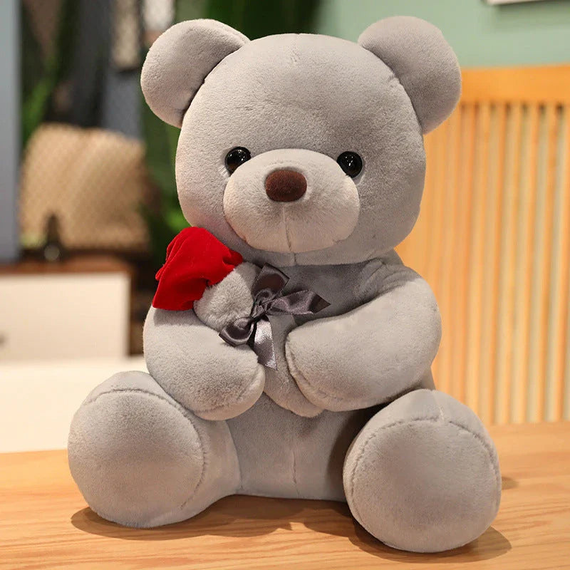 Soft and huggable teddy bear plush pillow in brown, beige, and grey colors