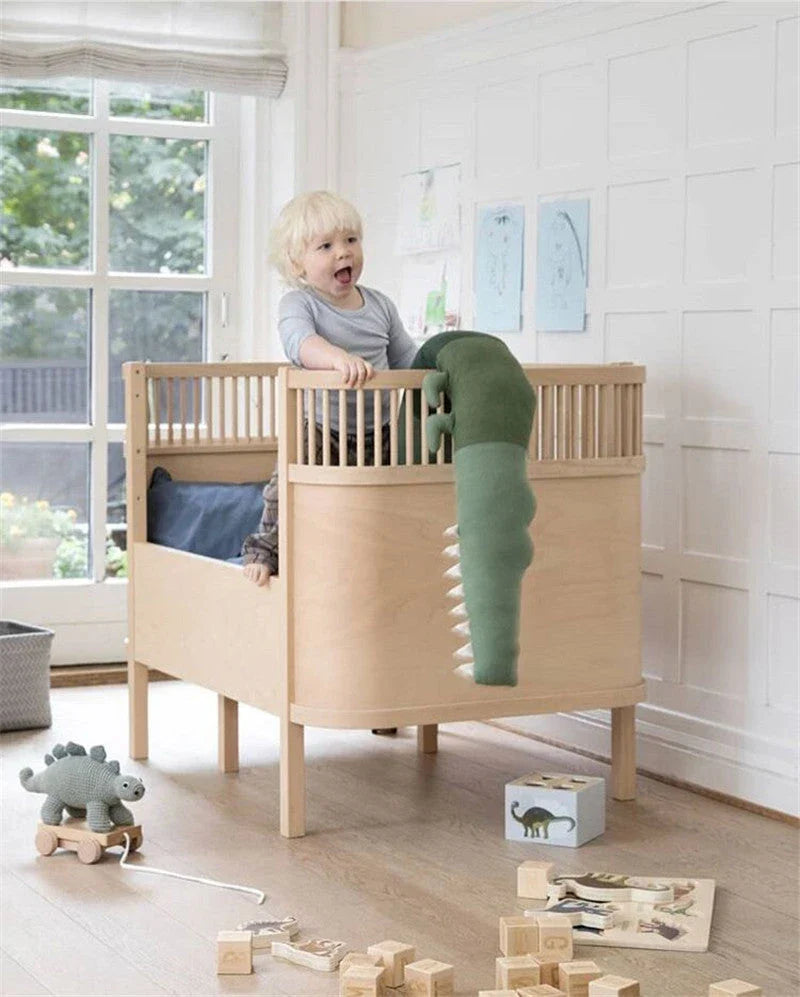 Soft and cuddly crocodile-themed plush cushion for cots, sofas and nursery decor