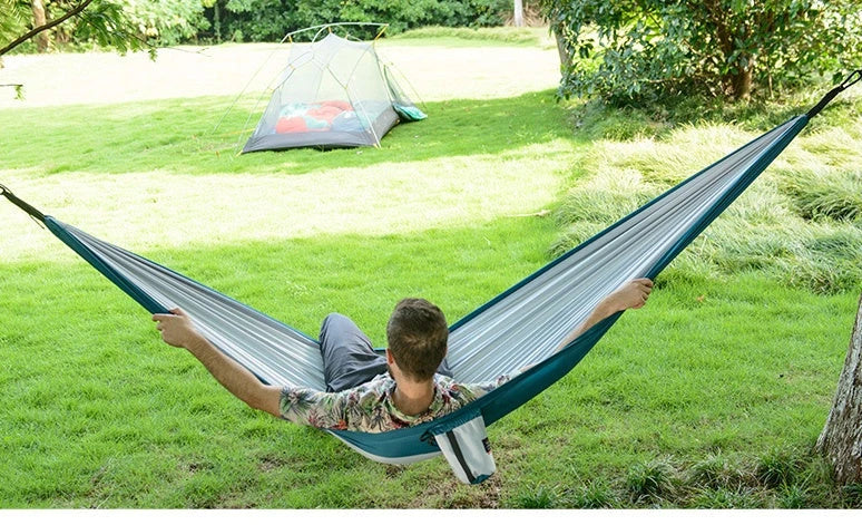 Premium double hammock for outdoor camping and hunting, made with soft, breathable fabric and reinforced climbing ropes