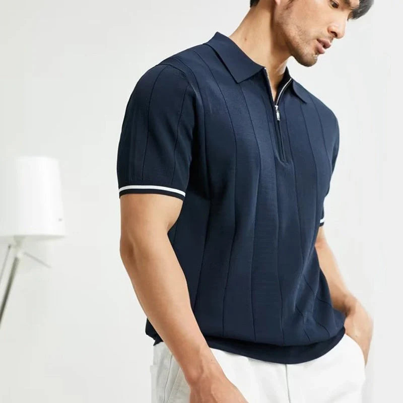 Short-sleeved polo shirt with zipper collar, available in white and dark blue colours, suitable for British summer style.