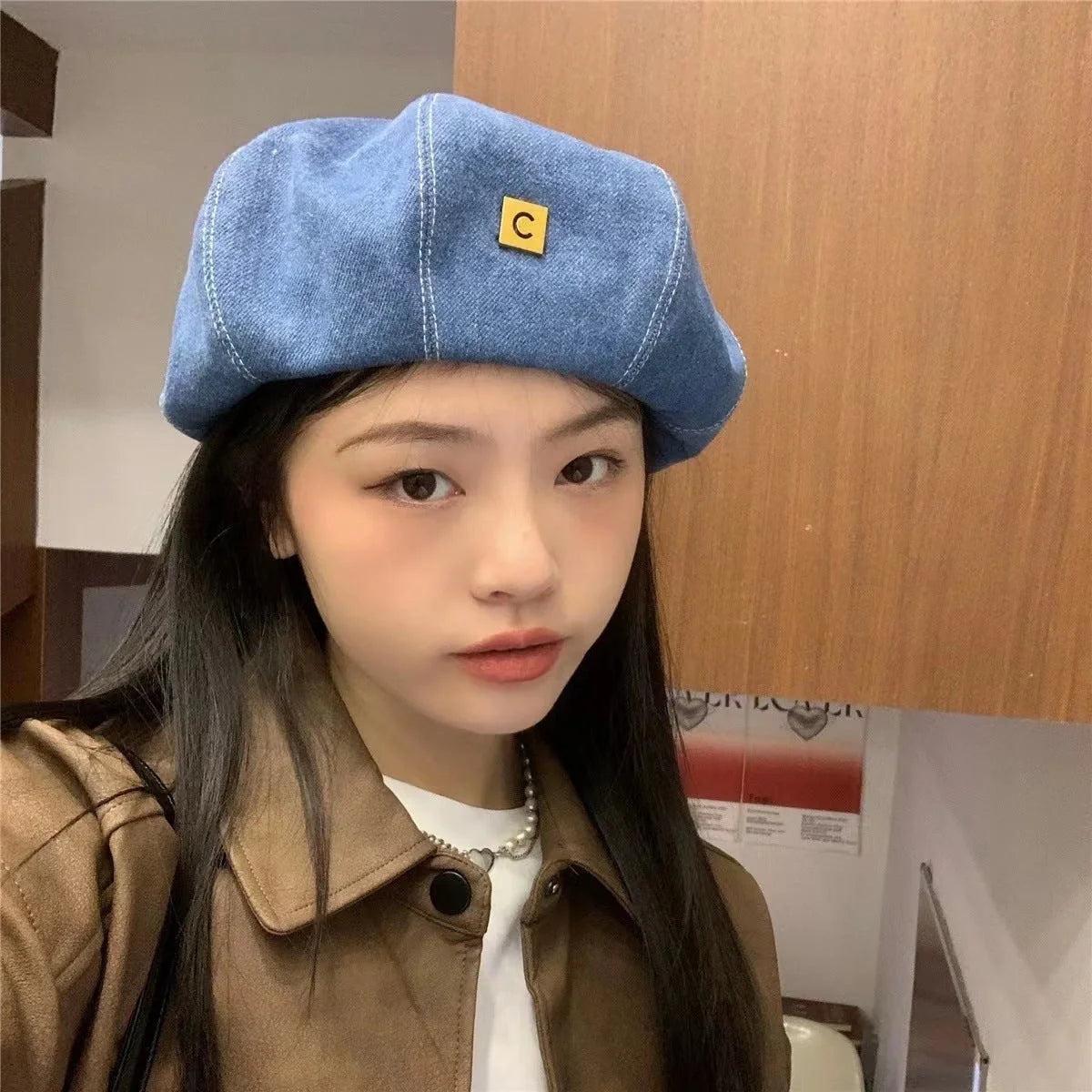 A stylish Japanese-inspired denim beret with a dome-shaped crown and a brimless silhouette, available in light, medium, and dark denim shades.