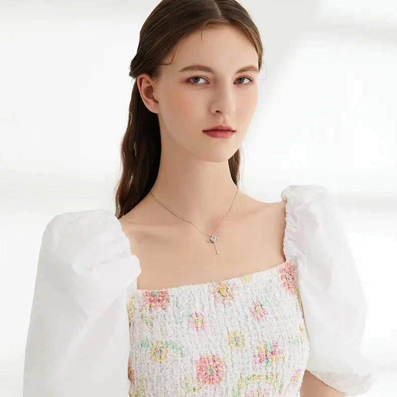 Enchanting necklace with Cupid heart and fluttering angel wings, crafted with titanium steel and sparkling zircon crystals