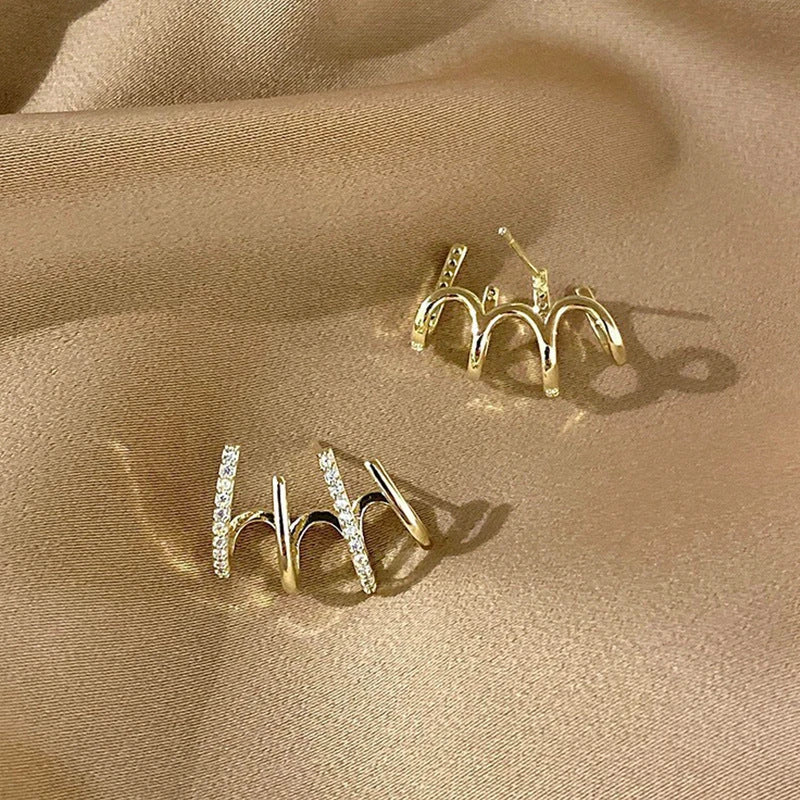 Radiant sterling silver earrings with four-prong zircon stone settings, elegant and fashionable jewelry for women