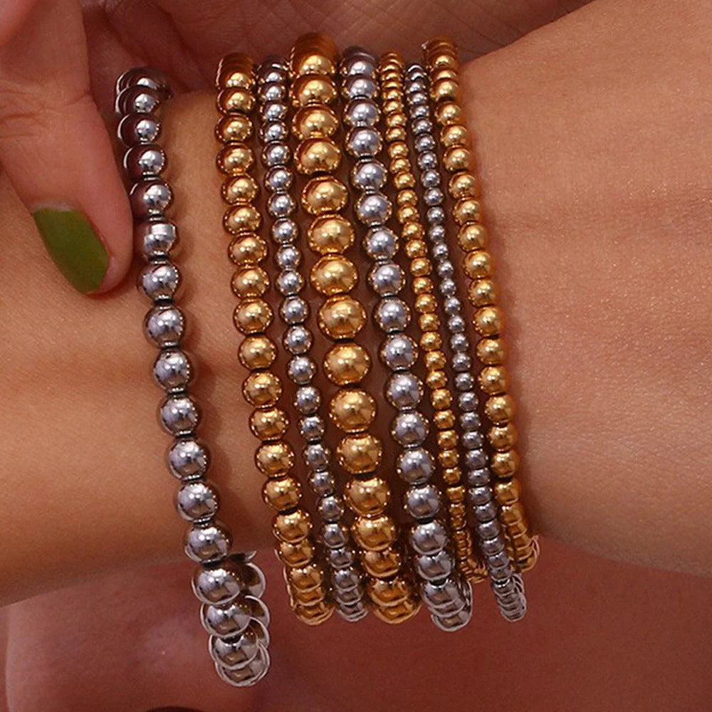 Vintage-inspired stainless steel and 18K plated elastic bead bracelet in a range of sizes and colours