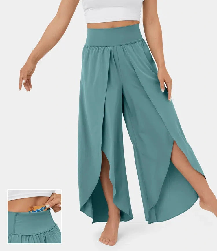 Versatile high-waist split-leg yoga trousers in a variety of colours, featuring a wide-leg silhouette and elasticated waistband for comfort and style.