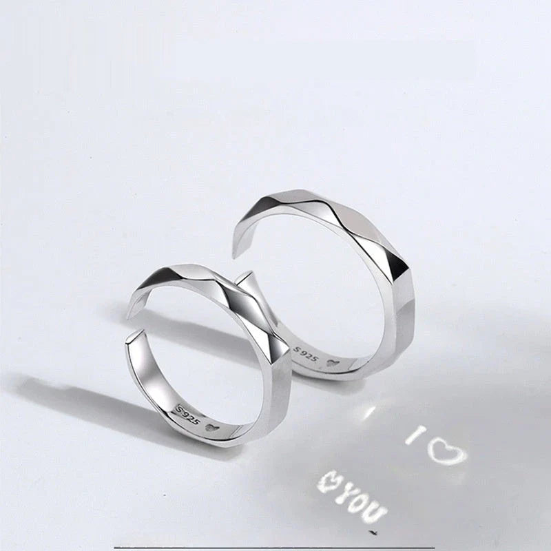Stylish sterling silver rings with a hidden love pattern design, perfect for romantic gifts or personal accessorizing.