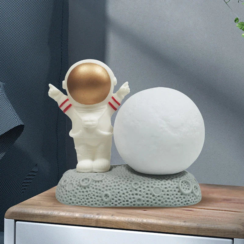 Astronaut-themed colour-changing night lamp with durable natural resin construction