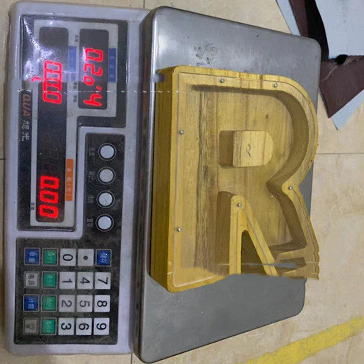 Personalized letter-shaped wooden money bank with clear viewing window for tracking savings progress