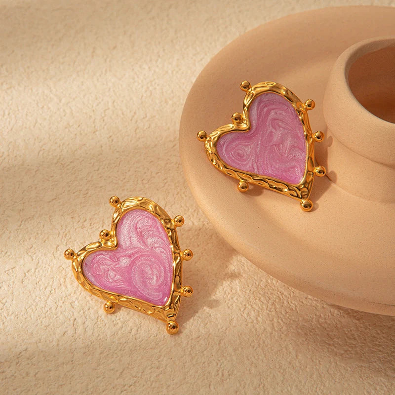 Elegant stainless steel heart-shaped earrings in a range of captivating colours, perfect for adding a touch of romantic flair to any outfit.