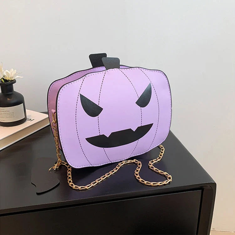 Enchanting Halloween pumpkin-themed shoulder bag in various colours, featuring an adjustable chain strap and trendy urban style
