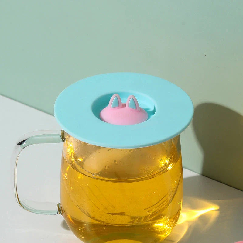 Spill-Proof Cat Ear Silicone Drink Lid in various colors, including pink, orange, and blue