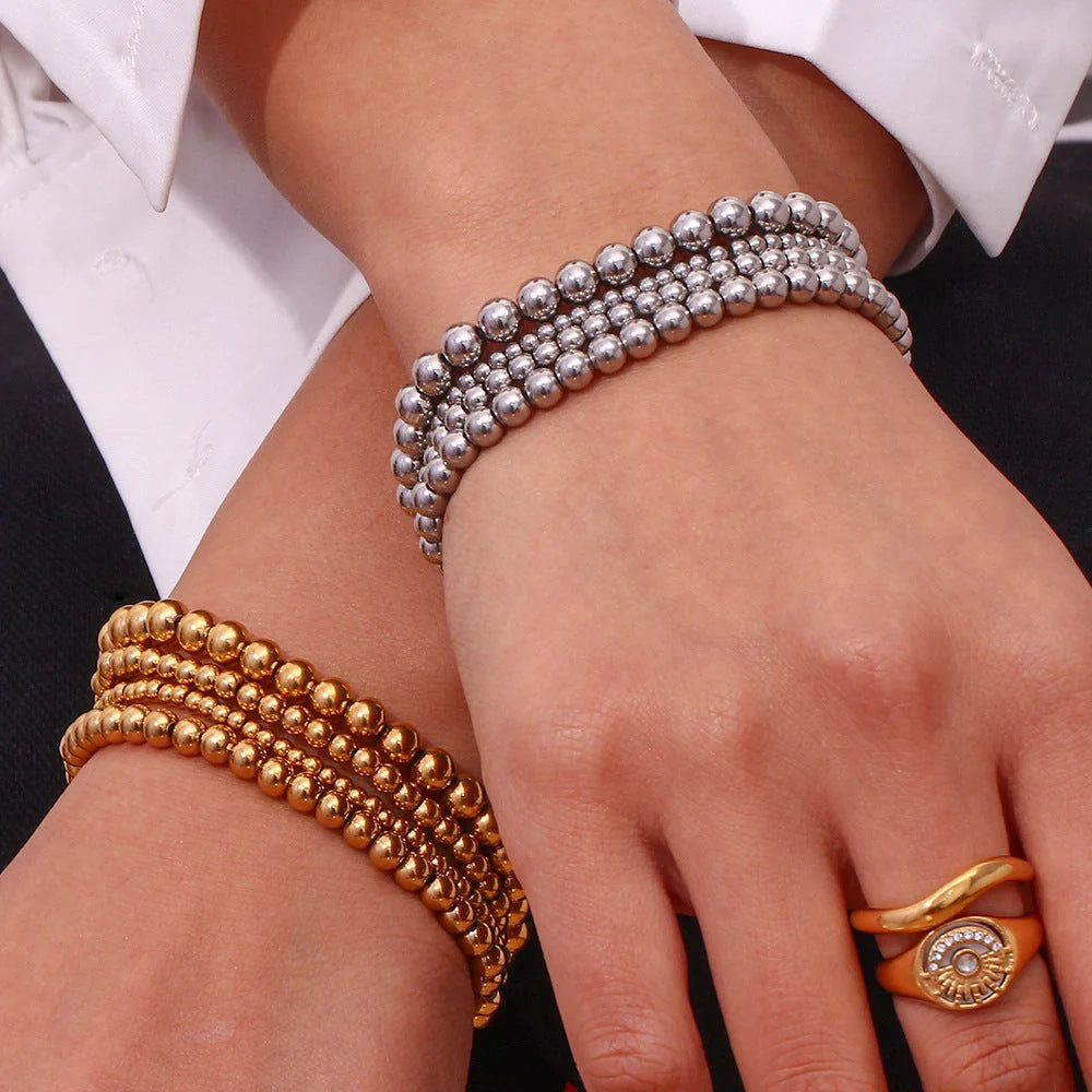 Vintage-inspired stainless steel and 18K plated elastic bead bracelet in a range of sizes and colours