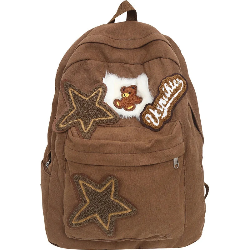 A stylish and durable canvas backpack with geometric patterns, designed for female college students